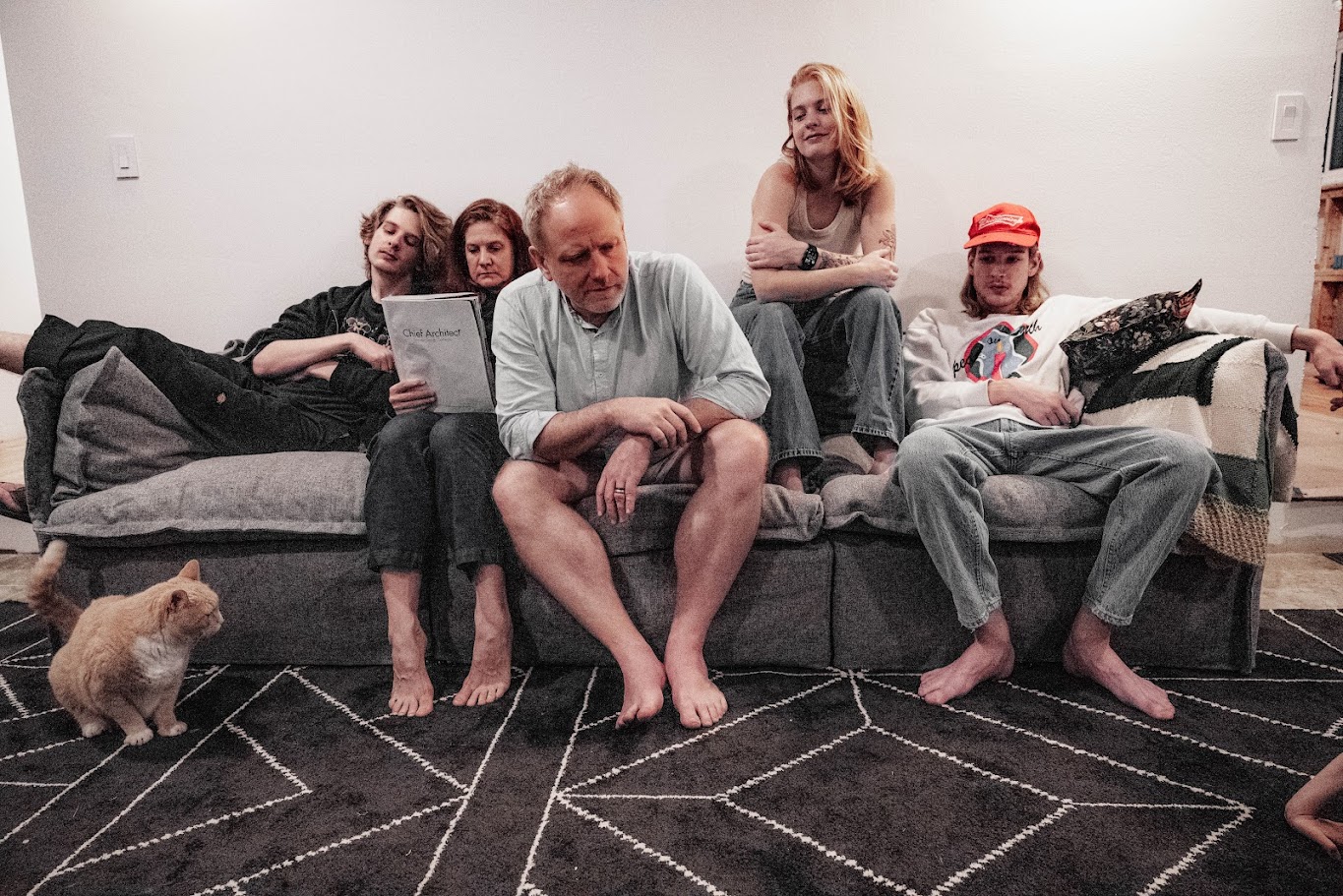 The Bennage family on a couch with cats, reading Chief Architect