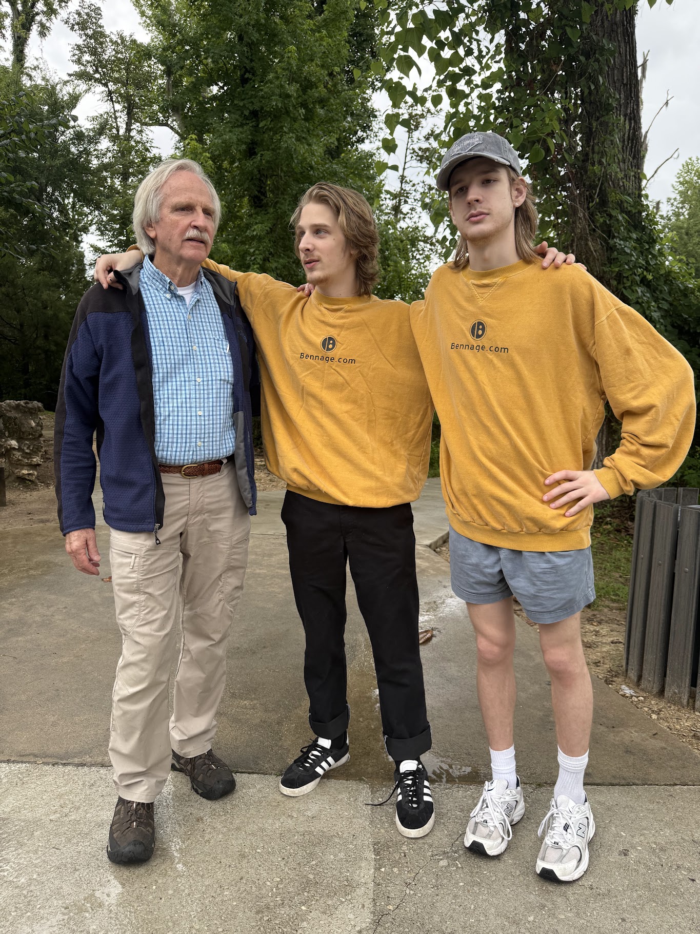 Three generations of Bennage men in matching Bennage.com sweatshirts
